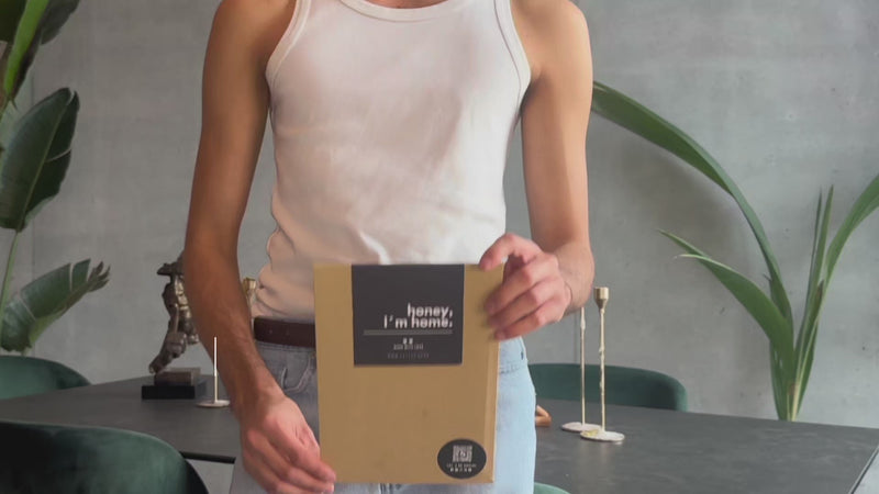 Person holding a Tattup tattoo pack before applying it
