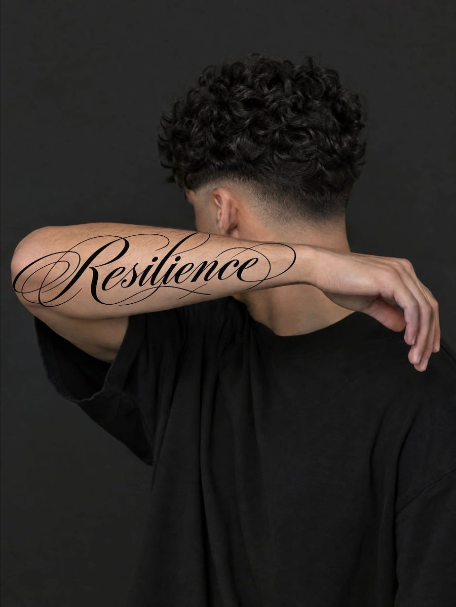 Resilience lettering in Huge on the forearm in the studio preview
